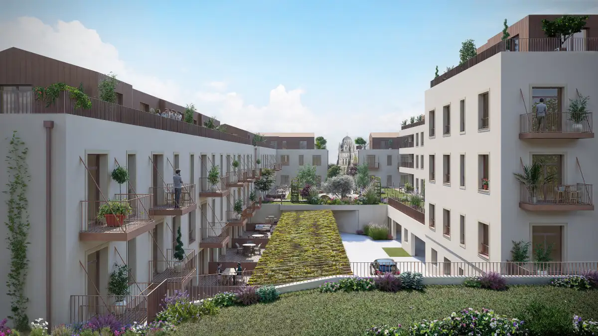 Vue du cœur de l’allée centrale paysagée de la Résidence Le Belvédère à Saintes, entourée des bâtiments résidentiels et des espaces verts.